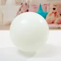 Close-up detail shot of a classic white latex balloon for party and wedding decoration. - Green