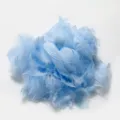 Detail shot of fluffy light blue dyed feathers, ideal for DIY bobo ball filling and crafts. - Light Blue