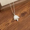 Silver bell pendant necklace with small heart charm for women, elegant sweater chain jewelry. - Bell and Heart Pendant Necklaces