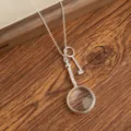 Silver magnifying glass and key pendant necklace, vintage style long sweater chain jewelry accessory. - Magnifying Glass Necklace