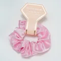 Detail of a pink satin scrunchie featuring a gold-stamped bridesmaid gift card - Pink