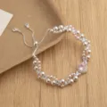 Elegante meerdelige parel- en strass-verstelbare armband met roze kristal voor dames. - Parelarmband met roosgeslepen zirkonia