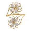 Elegant gold tone double flower open arm cuff bracelet with white enamel floral design. - Off White