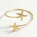 Bracciale rigido aperto stella marina oro, gioiello da braccio metallo spiaggia estate elegante - Oro
