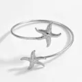 Bracciale aperto a stella marina argentato, gioiello da spiaggia vacanza regolabile. - Argento