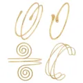 Gold metal open arm cuff set detail showing geometric multi turn spiral and wavy bracelet designs. - S57 Four Piece Set / Gold