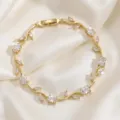 Exquisite gold-plated vine branch bracelet featuring sparkling cubic zirconia stones for women. - White Main Stone Branch Gold (TS0480)