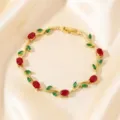 Exquisite gold-plated twig bracelet featuring vibrant red and green zircon stones, perfect detailed shot. - Red Green Main Stone Branch Gold (TS0481)
