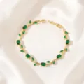 Detailed view of the gold-plated branch green zirconia bracelet showcasing exquisite leaf design. - Green Main Stone Leaf Gold (TS0472)