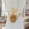 Detail view of luxury gold butterfly and fabric rose flower curtain holdback clip for home decor. - Coffee Flower (Gold)