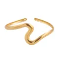 Gold metal wavy open cuff bracelet, chic geometric irregular glossy arm jewelry item - Wave Gold