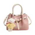 Pink leather handbag with white handles and cute bear charm for women daily fashion style - Pink