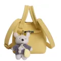 Sac seau jaune en cuir grainé avec pendentif d'ours, élégant design porté main et bandoulière. - Avec Pendentif / Jaune