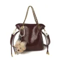 Stylish quilted bucket bag with chain strap and cute bear pendant for women casual commute. - Burgundy