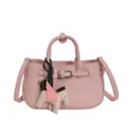 Pink leather top handle shoulder crossbody bag with cute pegasus wing charm accessory. - Pink