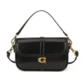 Sac à bandoulière noir brillant avec quincaillerie dorée et fermoir G élégant pour femmes. - Noir