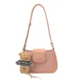 Pink underarm shoulder bag for women with cute teddy bear charm and chic star pattern design. - Pink