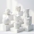 Detailed view of various white 3D floral and fruit shaped aroma diffuser stones or molds. - Plaster Vase Molds