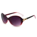 Donna moda grande montatura occhiali da sole sfumato rosso nero con dettaglio floreale oro. - Montatura rossa e rosa con lenti grigio sfumato