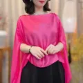 Detail view of a vibrant pink sheer cape shawl top, elegant and lightweight design. - Rose Red