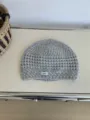 Grey hollow-out knit beanie detail view, showing soft wool texture and a minimalist label. - 26*20cm / Gray