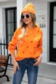 Casual women's orange crewneck knit sweater with red polka dots and matching beanie - Orange