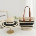 Detail view of stylish straw woven sun hat and striped tote bag set for summer beach vacation. - Fine Stripes - Beige + Black