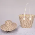Detailed view of the woven straw tote bag and matching sun hat set with brown and white pattern. - Single Hat / Dark Khaki