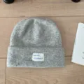 Grey knitted beanie hat for women, thick warm wool blend winter cap with woven front label. - One Size / Light Gray