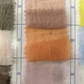 Gauze fabric color swatch variant, sheer bubble yarn material sample for wedding decor. - 90-180cm Seersucker with Four-Side Frayed Edges / No. 87 Bright Orange