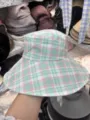 Detailed view of the stylish green and pink plaid bucket hat with wide brim for women summer. - Plaid Green