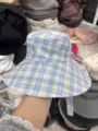 Blue and yellow plaid bucket hat detail showing the wide brim and soft cotton fabric texture. - Plaid Blue