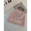 Pink wool blend knit beanie for women, cozy winter skull cap with letter design and soft feel. - One Size / Pink
