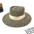 Detailed view of the French style black and white woven fedora hat with a beige fabric band. - M (56-58cm) / Black (Beige Strap)