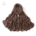 Close-up detail view of the soft khaki modal cotton scarf, showing fine texture and drapes. - Khaki