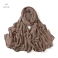 Close-up detail view of the solid color modal rayon scarf showing fine texture and edges. - Wheat
