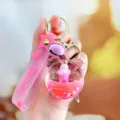 Mignon lapin de baignoire rose porte-clés liquide sac charme avec cloche mignonne - Lapin baignoire rose à l'huile - Réveil