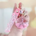 Roze zeester drijfzand sleutelhanger, acryl vloeistof tas bedel, schattig cadeau accessoire. - Roze Zeester Schelp Drijffles