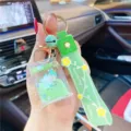 Schattige vloeibare drijfzand eenhoorn sleutelhanger met groene tas hanger accessoire - Groene melkpak eenhoorn