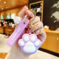 Schattige paarse kattenpoot sleutelhanger met siliconen band, stijlvolle tasbedel. - Katzenpoot - Paars