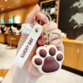 Schattige kattenpoot sleutelhanger met metalen ring en siliconen bandje, creatieve hanger - Kattenpoot - Bruin