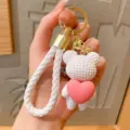 Witte geweven polsband sleutelhanger met schattige beer en roze hart hangeraccessoire. - Wit