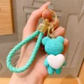 Schattige turquoise gebreide beren sleutelhanger met wit hart voor tassen en sleutels. - Groen