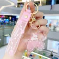 Roze kersenbloesem vloeibare zandloper eenhoorn sleutelhanger, leuke rugzakhanger. - Sakura Eenhoorn-Roze