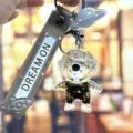 Leuke astronaut drijfzand sleutelhanger stijlvolle tas hanger auto sleutelring - Individuele Verpakking / Zwart & gouden astronaut - staand zwart gezicht