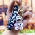 Schattige astronaut sleutelhanger met reflecterende helm en siliconen bandje. - Stoere astronaut - paars
