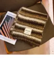 Cozy brown striped knitted scarf detail, soft mohair texture winter warm neck wrap chic design. - Coffee