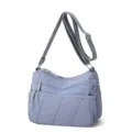 Grey-blue washed nylon crossbody bag, versatile multi-pocket shoulder bag variant. - Blue