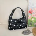 Black polka dot underarm bag with bow and chain strap variant style for women fashion daily use. - Black