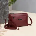 Burgundy PU leather multi-compartment crossbody shoulder bag for women daily use. - Red